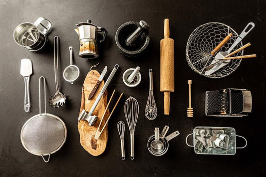 Various kitchen utensils on a dark background